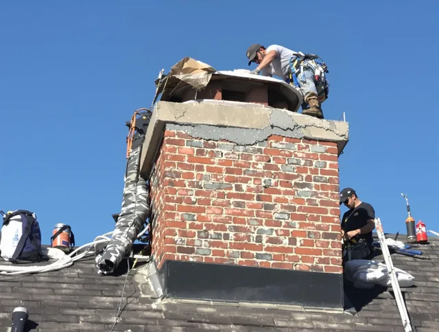 Perris Chimney Sweep installing a custom chimney crown in Perris, CA