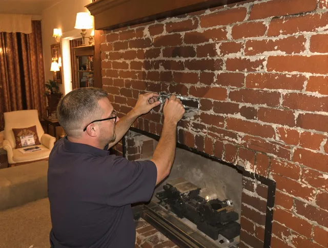 Perris Chimney Sweep expert fixing a fireplace in Perris, CA